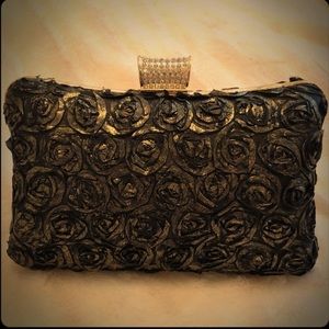 Black and gold hard clutch
